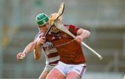 3 December 2023; Ryan McCambridge of Ruairí Óg is tackled by Shane McGuigan of Slaughtneil during the AIB Ulster GAA Hurling Senior Club Championship final match between Ruairi Óg, Antrim, and Slaughtneil, Derry, at Páirc Esler in Newry, Down. Photo by Ben McShane/Sportsfile