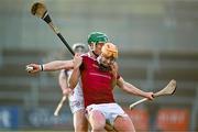 3 December 2023; Ryan McCambridge of Ruairí Óg is tackled by Shane McGuigan of Slaughtneil during the AIB Ulster GAA Hurling Senior Club Championship final match between Ruairi Óg, Antrim, and Slaughtneil, Derry, at Páirc Esler in Newry, Down. Photo by Ben McShane/Sportsfile