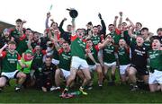 3 December 2023; St Brigid's joint-captain Paul McGrath lifts the Shane McGettigan cup as he celebrates with team-mates after their side's victory in the AIB Connacht GAA Football Senior Club Championship final between St Brigid's, Roscommon, and Corofin, Galway, at Dr Hyde Park in Roscommon. Photo by Piaras Ó Mídheach/Sportsfile