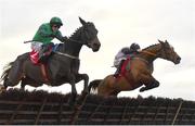 3 December 2023; Teahupoo, right, with Jack Kennedy up, jumps the last on their way to winning the Bar One Racing Hatton's Grace Hurdle, from second place Impaire Et Passe, left, with Paul Townend up, during day two of the Fairyhouse Winter Festival at Fairyhouse Racecourse in Ratoath, Meath. Photo by Seb Daly/Sportsfile