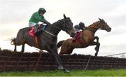 3 December 2023; Teahupoo, right, with Jack Kennedy up, jumps the last on their way to winning the Bar One Racing Hatton's Grace Hurdle, from second place Impaire Et Passe, left, with Paul Townend up, during day two of the Fairyhouse Winter Festival at Fairyhouse Racecourse in Ratoath, Meath. Photo by Seb Daly/Sportsfile