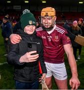 3 December 2023; Ryan McCambridge of Ruairí Óg takes a selfie with a supporter after the AIB Ulster GAA Hurling Senior Club Championship final match between Ruairi Óg, Antrim, and Slaughtneil, Derry, at Páirc Esler in Newry, Down. Photo by Ben McShane/Sportsfile