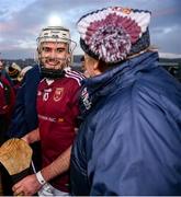 3 December 2023; Ronan McAteer of Ruairí Óg celebrates with a supporter after the AIB Ulster GAA Hurling Senior Club Championship final match between Ruairi Óg, Antrim, and Slaughtneil, Derry, at Páirc Esler in Newry, Down. Photo by Ben McShane/Sportsfile