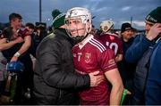 3 December 2023; Francis McCurry of Ruairí Óg celebrates with a supporter after the AIB Ulster GAA Hurling Senior Club Championship final match between Ruairi Óg, Antrim, and Slaughtneil, Derry, at Páirc Esler in Newry, Down. Photo by Ben McShane/Sportsfile