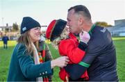 3 December 2023; St Brigid's goalkeeper Cormac Sheehy celebrates with his daughter Emily and his wife Anne after victory in the AIB Connacht GAA Football Senior Club Championship final between St Brigid's, Roscommon, and Corofin, Galway, at Dr Hyde Park in Roscommon. Photo by Piaras Ó Mídheach/Sportsfile