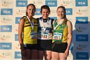 2 December 2023; The podium for the Novice Women's race, first place Lucy Holmes of West Waterford A.C., centre, second place Roise Roberts of North Belfast Harriers, left, and third place Amy Pollman Daamen of An Ríocht A.C. during the 123.ie National Novice & Juvenile Uneven Age Cross Country Championships at Navan Racecourse in Navan, Meath. Photo by David Fitzgerald/Sportsfile