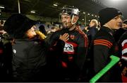 3 December 2023; Harry Ruddle of Ballygunner celebrates with a supporter after the AIB Munster GAA Hurling Senior Club Championship final match between Ballygunner, Waterford, and Clonlara, Clare, at FBD Semple Stadium in Thurles, Tipperrary. Photo by Brendan Moran/Sportsfile