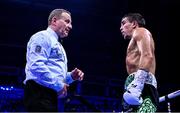2 December 2023; Michael Conlan, and referee Howard Foster, during his super-featherweight bout against Jordan Gill at the SSE Arena in Belfast. Photo by Ramsey Cardy/Sportsfile