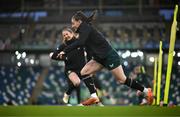 4 December 2023; Lucy Quinn and Kyra Carusa, left, during a Republic of Ireland women training session at the National Football Stadium at Windsor Park in Belfast. Photo by Stephen McCarthy/Sportsfile