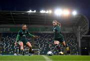 4 December 2023; Izzy Atkinson and Katie McCabe, left, during a Republic of Ireland women training session at the National Football Stadium at Windsor Park in Belfast. Photo by Stephen McCarthy/Sportsfile