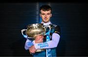 5 December 2023; Maynooth University hurler Billy Drennan poses for a portrait with the Fitzgibbon Cup before the draw for the Electric Ireland GAA Higher Education Championships at Croke Park in Dublin. Photo by Piaras Ó Mídheach/Sportsfile