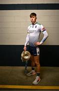 5 December 2023; University of Limerick hurler Gearóid O'Connor poses for a portrait with the Fitzgibbon Cup before the draw for the Electric Ireland GAA Higher Education Championships at Croke Park in Dublin. Photo by Piaras Ó Mídheach/Sportsfile