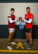 5 December 2023; University of Galway footballer Tommy Conroy, left, and University College Cork footballer Dylan Foley with the Sigerson Cup before the draw for the Electric Ireland GAA Higher Education Championships at Croke Park in Dublin. Photo by Piaras Ó Mídheach/Sportsfile