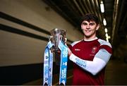 5 December 2023; University of Galway footballer Tommy Conroy poses for a portrait with the Sigerson Cup before the draw for the Electric Ireland GAA Higher Education Championships at Croke Park in Dublin. Photo by Piaras Ó Mídheach/Sportsfile