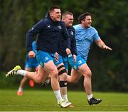 5 December 2023; Dan Sheehan, left, Jack Boyle and Thomas Clarkson during a Leinster Rugby squad training session at UCD in Dublin. Photo by Brendan Moran/Sportsfile