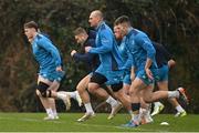 5 December 2023; Rhys Ruddock, centre, during a Leinster Rugby squad training session at UCD in Dublin. Photo by Brendan Moran/Sportsfile