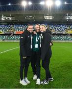 5 December 2023; Republic of Ireland players, from left, Abbie Larkin, Kyra Carusa and Izzy Atkinson before the UEFA Women's Nations League B match between Northern Ireland and Republic of Ireland at the National Football Stadium at Windsor Park in Belfast. Photo by Stephen McCarthy/Sportsfile
