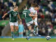 5 December 2023; Katie McCabe of Republic of Ireland in action against Chloe McCarron, 7, and Nadene Caldwell of Northern Ireland during the UEFA Women's Nations League B match between Northern Ireland and Republic of Ireland at the National Football Stadium at Windsor Park in Belfast. Photo by Stephen McCarthy/Sportsfile