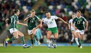 5 December 2023; Katie McCabe of Republic of Ireland in action against Northern Ireland players, from left, Chloe McCarron, Nadene Caldwell and Caragh Hamilton during the UEFA Women's Nations League B match between Northern Ireland and Republic of Ireland at the National Football Stadium at Windsor Park in Belfast. Photo by Stephen McCarthy/Sportsfile