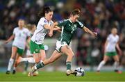 5 December 2023; Rebecca McKenna of Northern Ireland in action against Lucy Quinn of Republic of Ireland during the UEFA Women's Nations League B match between Northern Ireland and Republic of Ireland at the National Football Stadium at Windsor Park in Belfast. Photo by Stephen McCarthy/Sportsfile