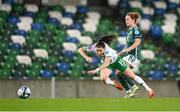 5 December 2023; Lucy Quinn of Republic of Ireland is tackled by Marissa Callaghan of Northern Ireland during the UEFA Women's Nations League B match between Northern Ireland and Republic of Ireland at the National Football Stadium at Windsor Park in Belfast. Photo by Stephen McCarthy/Sportsfile