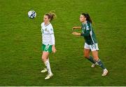 5 December 2023; Kyra Carusa of Republic of Ireland in action against Laura Rafferty of Northern Ireland during the UEFA Women's Nations League B match between Northern Ireland and Republic of Ireland at the National Football Stadium at Windsor Park in Belfast. Photo by Ramsey Cardy/Sportsfile
