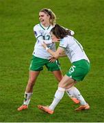 5 December 2023; Lucy Quinn of Republic of Ireland celebrates with teammate Jamie Finn, left, after scoring their side's first goal during the UEFA Women's Nations League B match between Northern Ireland and Republic of Ireland at the National Football Stadium at Windsor Park in Belfast. Photo by Ramsey Cardy/Sportsfile