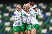 5 December 2023; Kyra Carusa of Republic of Ireland, second from right, celebrates with teammates, from left, Jamie Finn, Denise O'Sullivan and Heather Payne after scoring their third goal during the UEFA Women's Nations League B match between Northern Ireland and Republic of Ireland at the National Football Stadium at Windsor Park in Belfast. Photo by Stephen McCarthy/Sportsfile