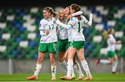 5 December 2023; Kyra Carusa of Republic of Ireland, second from right, celebrates with teammates, from left, Jamie Finn, Denise O'Sullivan and Heather Payne after scoring their third goal during the UEFA Women's Nations League B match between Northern Ireland and Republic of Ireland at the National Football Stadium at Windsor Park in Belfast. Photo by Stephen McCarthy/Sportsfile