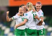 5 December 2023; Louise Quinn of Republic of Ireland celebrates with teammates, from left, Denise O'Sullivan, Katie McCabe and Caitlin Hayes after scoring their side's fifth goal during the UEFA Women's Nations League B match between Northern Ireland and Republic of Ireland at the National Football Stadium at Windsor Park in Belfast. Photo by Stephen McCarthy/Sportsfile