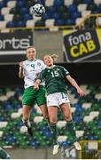 5 December 2023; Louise Quinn of Republic of Ireland scores her side's fifth goal despite the attention of Rebecca Holloway of Northern Ireland during the UEFA Women's Nations League B match between Northern Ireland and Republic of Ireland at the National Football Stadium at Windsor Park in Belfast. Photo by Stephen McCarthy/Sportsfile