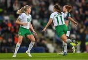 5 December 2023; Katie McCabe of Republic of Ireland celebrates with Denise O'Sullivan, left, after scoring her side's fourth goal during the UEFA Women's Nations League B match between Northern Ireland and Republic of Ireland at the National Football Stadium at Windsor Park in Belfast. Photo by Ramsey Cardy/Sportsfile