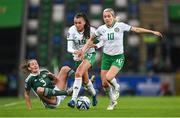 5 December 2023; Denise O'Sullivan of Republic of Ireland, supported by teammate Abbie Larkin, left, get away from Demi Vance of Northern Ireland during the UEFA Women's Nations League B match between Northern Ireland and Republic of Ireland at the National Football Stadium at Windsor Park in Belfast. Photo by Stephen McCarthy/Sportsfile