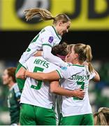 5 December 2023; Caitlin Hayes of Republic of Ireland, 5, celebrates with teammates, from left, Izzy Atkinson, top, and Jessie Stapleton after scoring their side's sixth goal during the UEFA Women's Nations League B match between Northern Ireland and Republic of Ireland at the National Football Stadium at Windsor Park in Belfast. Photo by Ramsey Cardy/Sportsfile