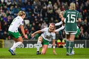 5 December 2023; Caitlin Hayes of Republic of Ireland celebrates with Jessie Stapleton, left, and Lily Agg, right, after scoring their side's sixth goal during the UEFA Women's Nations League B match between Northern Ireland and Republic of Ireland at the National Football Stadium at Windsor Park in Belfast. Photo by Ramsey Cardy/Sportsfile