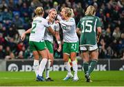 5 December 2023; Caitlin Hayes of Republic of Ireland celebrates with Jessie Stapleton, left, and Lily Agg, right, after scoring their side's sixth goal during the UEFA Women's Nations League B match between Northern Ireland and Republic of Ireland at the National Football Stadium at Windsor Park in Belfast. Photo by Ramsey Cardy/Sportsfile
