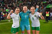 5 December 2023; Republic of Ireland players, from left, Chloe Mustaki, Courtney Brosnan and Megan Connolly after the UEFA Women's Nations League B match between Northern Ireland and Republic of Ireland at the National Football Stadium at Windsor Park in Belfast. Photo by Stephen McCarthy/Sportsfile