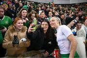 5 December 2023; Louise Quinn of Republic of Ireland with supporters after the UEFA Women's Nations League B match between Northern Ireland and Republic of Ireland at the National Football Stadium at Windsor Park in Belfast. Photo by Ramsey Cardy/Sportsfile