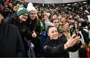 5 December 2023; Lucy Quinn of Republic of Ireland with supporters after the UEFA Women's Nations League B match between Northern Ireland and Republic of Ireland at the National Football Stadium at Windsor Park in Belfast. Photo by Ramsey Cardy/Sportsfile
