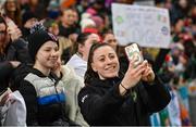 5 December 2023; Lucy Quinn of Republic of Ireland with supporters after the UEFA Women's Nations League B match between Northern Ireland and Republic of Ireland at the National Football Stadium at Windsor Park in Belfast. Photo by Ramsey Cardy/Sportsfile