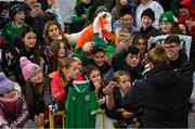 5 December 2023; Ruesha Littlejohn of Republic of Ireland with supporters after the UEFA Women's Nations League B match between Northern Ireland and Republic of Ireland at the National Football Stadium at Windsor Park in Belfast. Photo by Ramsey Cardy/Sportsfile
