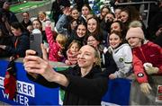 5 December 2023; Louise Quinn of Republic of Ireland with supporters after the UEFA Women's Nations League B match between Northern Ireland and Republic of Ireland at the National Football Stadium at Windsor Park in Belfast. Photo by Ramsey Cardy/Sportsfile