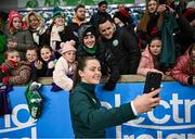 5 December 2023; Tyler Toland of Republic of Ireland with supporters after the UEFA Women's Nations League B match between Northern Ireland and Republic of Ireland at the National Football Stadium at Windsor Park in Belfast. Photo by Ramsey Cardy/Sportsfile