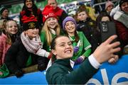 5 December 2023; Tyler Toland of Republic of Ireland with supporters after the UEFA Women's Nations League B match between Northern Ireland and Republic of Ireland at the National Football Stadium at Windsor Park in Belfast. Photo by Ramsey Cardy/Sportsfile