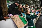 5 December 2023; Tyler Toland of Republic of Ireland with supporters after the UEFA Women's Nations League B match between Northern Ireland and Republic of Ireland at the National Football Stadium at Windsor Park in Belfast. Photo by Ramsey Cardy/Sportsfile
