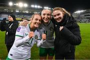 5 December 2023; Republic of Ireland players, from left, Lily Agg, Louise Quinn and Saoirse Noonan celebrate after the UEFA Women's Nations League B match between Northern Ireland and Republic of Ireland at the National Football Stadium at Windsor Park in Belfast. Photo by Stephen McCarthy/Sportsfile