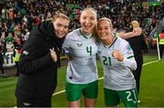 5 December 2023; Republic of Ireland players, from left, Saoirse Noonan, Louise Quinn and Lily Agg celebrate after the UEFA Women's Nations League B match between Northern Ireland and Republic of Ireland at the National Football Stadium at Windsor Park in Belfast. Photo by Stephen McCarthy/Sportsfile