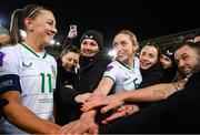 5 December 2023; Katie McCabe of Republic of Ireland speaks to her teammates, including Megan Connolly, right, after the UEFA Women's Nations League B match between Northern Ireland and Republic of Ireland at the National Football Stadium at Windsor Park in Belfast. Photo by Stephen McCarthy/Sportsfile
