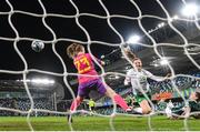 5 December 2023; Kyra Carusa of Republic of Ireland scores her side's third goal goal past Northern Ireland goalkeeper Maddison Harvey Clifford during the UEFA Women's Nations League B match between Northern Ireland and Republic of Ireland at the National Football Stadium at Windsor Park in Belfast. Photo by Stephen McCarthy/Sportsfile