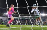 5 December 2023; Kyra Carusa of Republic of Ireland scores her side's third goal past Northern Ireland goalkeeper Maddison Harvey Clifford during the UEFA Women's Nations League B match between Northern Ireland and Republic of Ireland at the National Football Stadium at Windsor Park in Belfast. Photo by Stephen McCarthy/Sportsfile